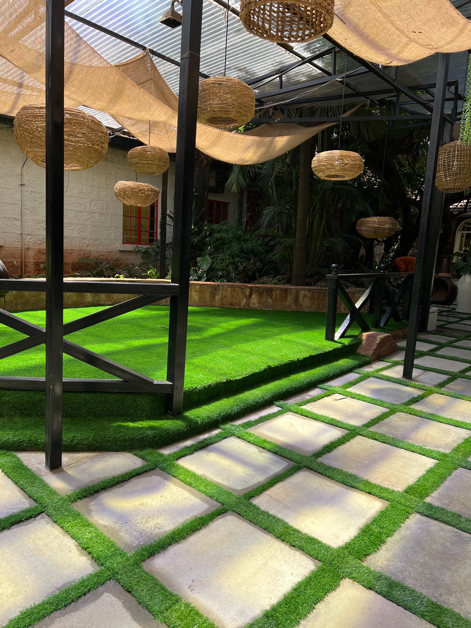Events and dining area with raised stage and artificial grass