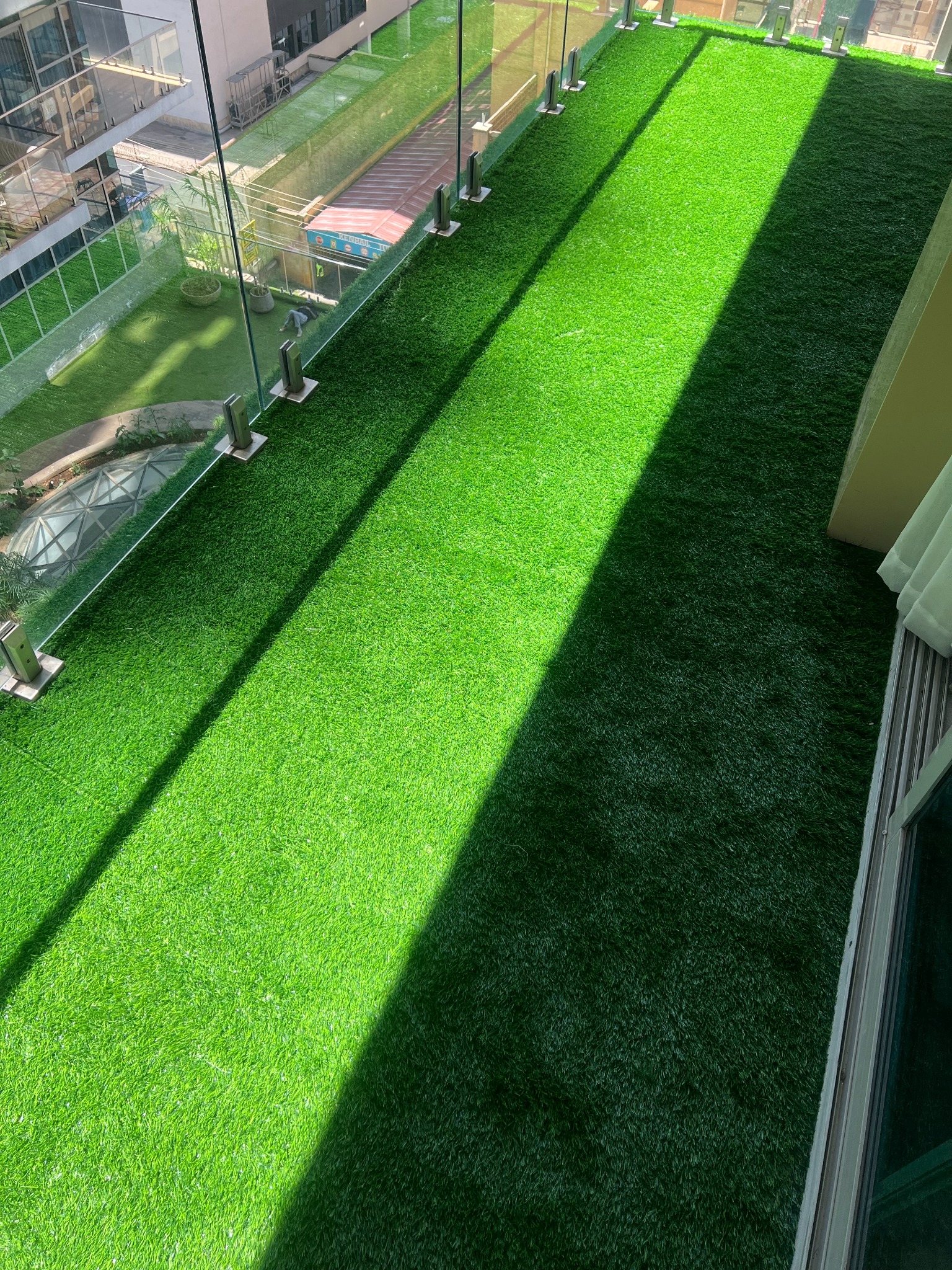 High-rise balcony with artificial grass installed by TurfgrassKE