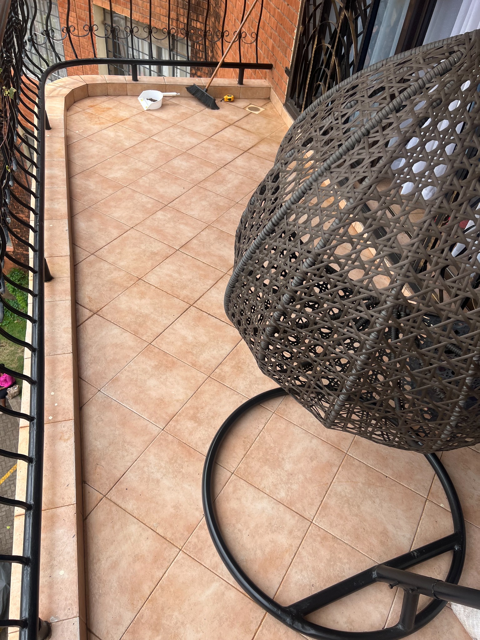 Small apartment balcony before artificial grass